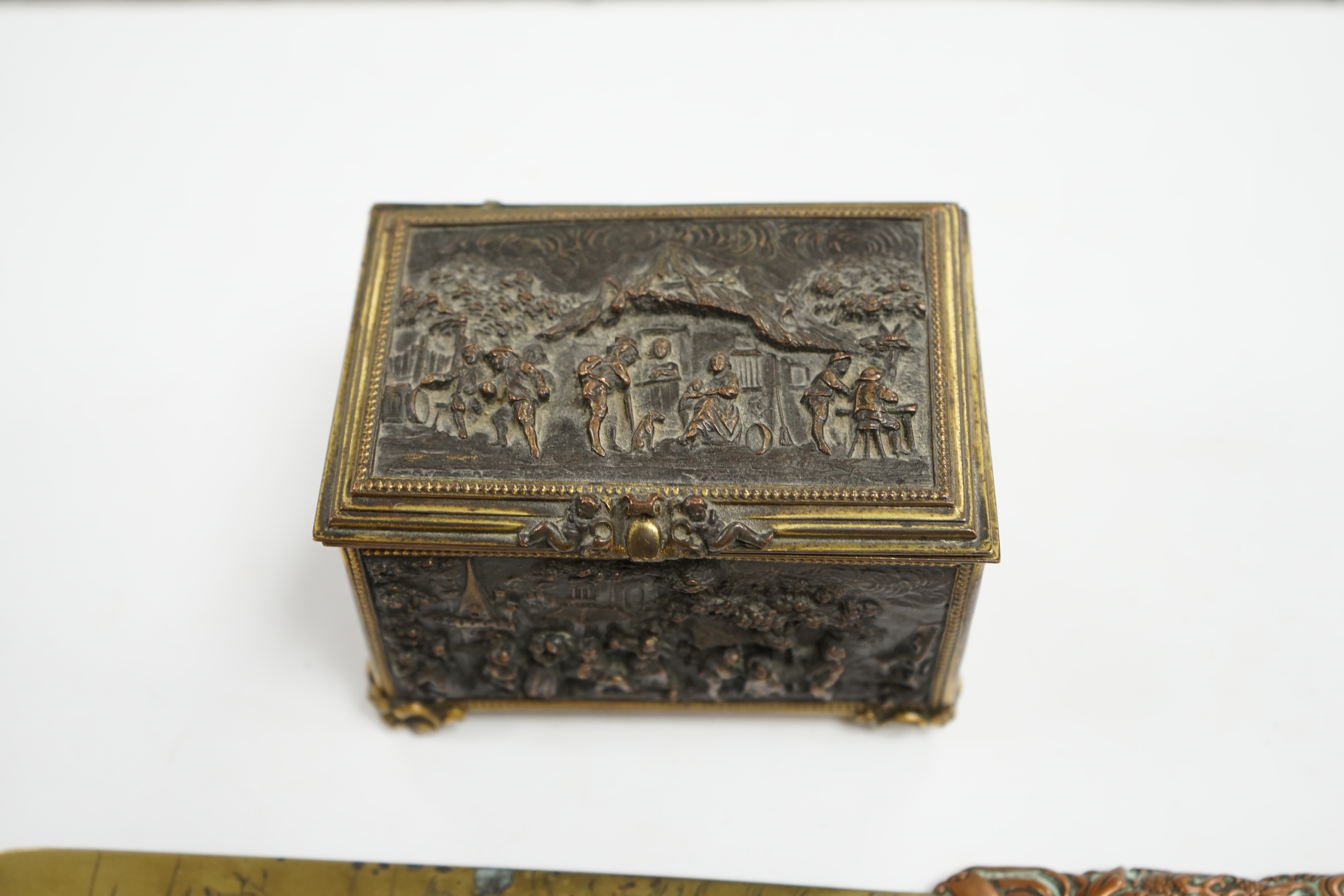 A Paris cast repousse figurative casket and a Japanese copper and brass paper knife, knife 30cm long. Condition - fair